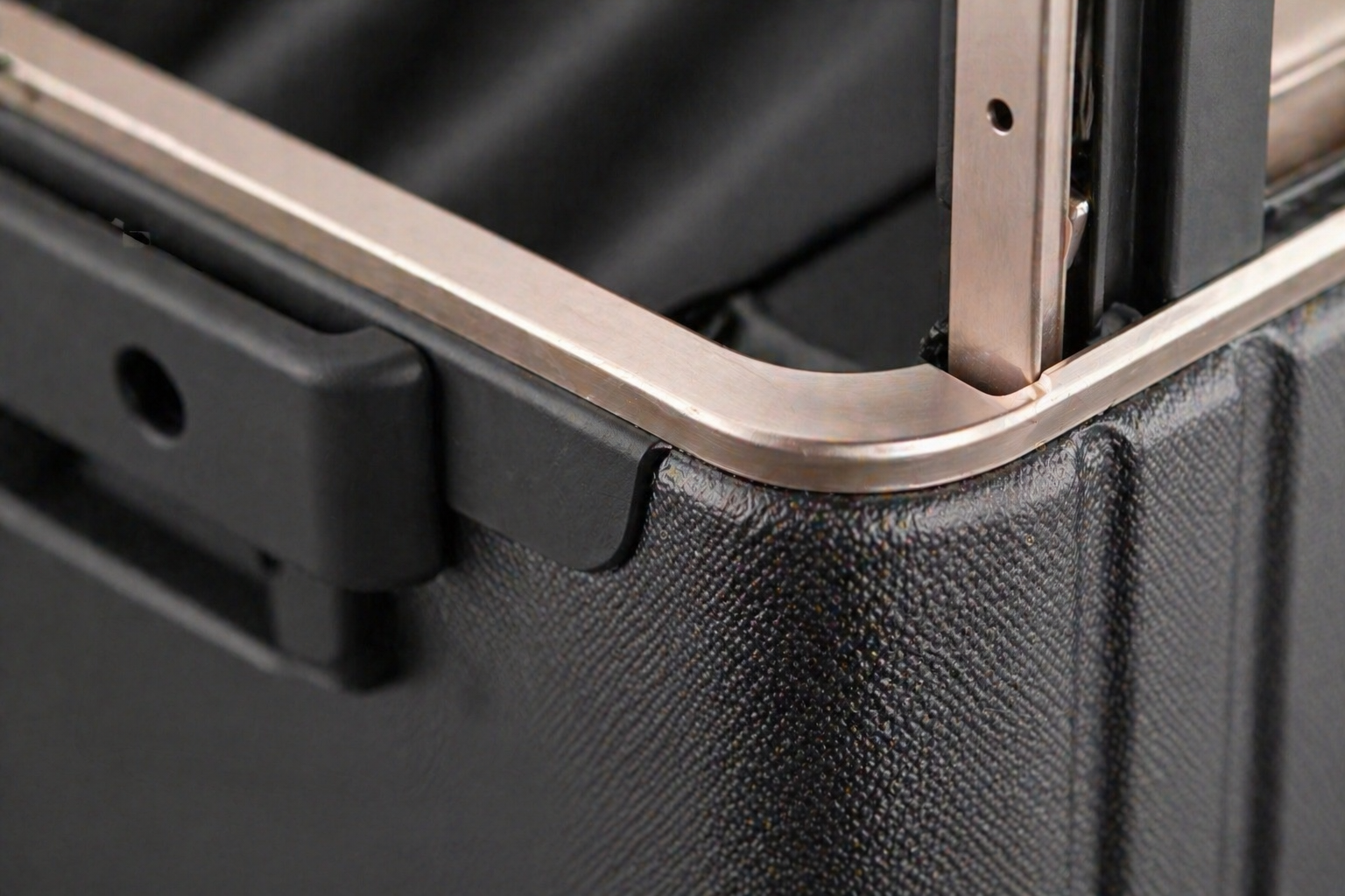 Close-up macro shot showing perfect structural bond line in luggage frame assembly