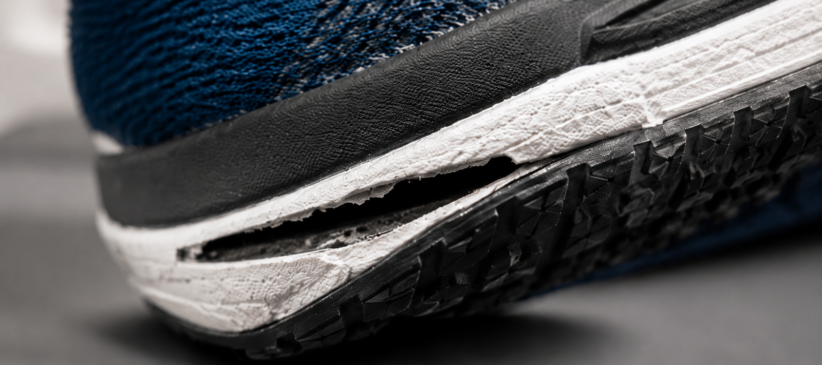Shoe component with delamination failure using standard adhesive